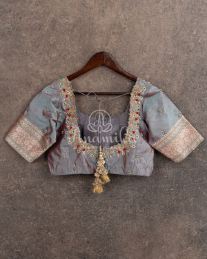 Teal Banarasi Silk Saree with a contrast hand work blouse