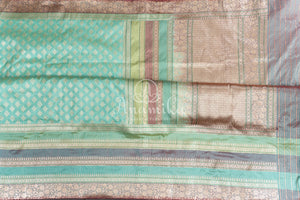 Teal Banarasi Silk Saree with a contrast hand work blouse