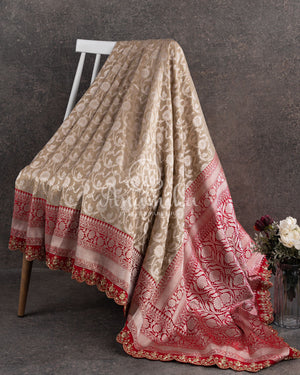 Stunning cream Banarasi Saree with red maggam work border