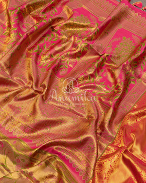 Bridal Kanjeevaram tissue saree in gold, with a contrast pink border