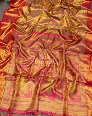 Bridal Kanjeevaram tissue saree in gold, with a contrast pink border