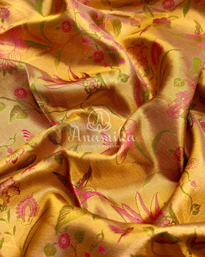 Bridal Kanjeevaram tissue saree in gold, with a contrast pink border