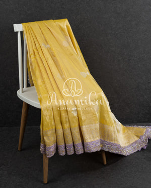 Yellow Banarasi Katan Tissue in Pastel Yellow with a stunning lavender zardosi work border