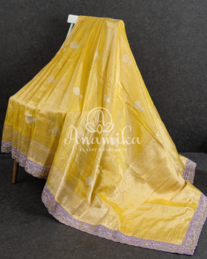 Yellow Banarasi Katan Tissue in Pastel Yellow with a stunning lavender zardosi work border