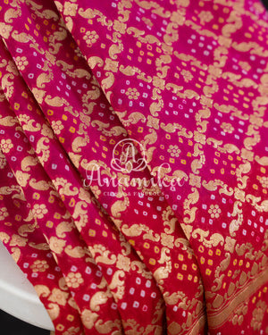 Pink/Red Bandini Georgette saree with a red off shoulder blouse