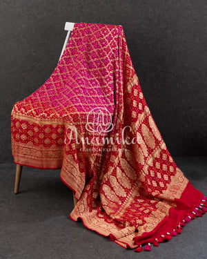 Pink/Red Bandini Georgette saree with a red off shoulder blouse