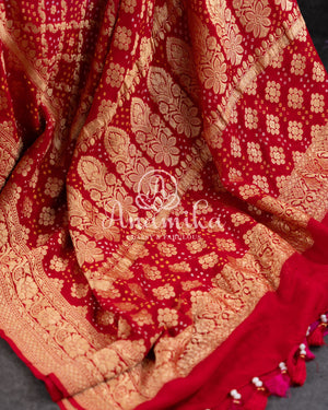 Pink/Red Bandini Georgette saree with a red off shoulder blouse