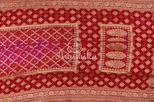 Pink/Red Bandini Georgette saree with a red off shoulder blouse