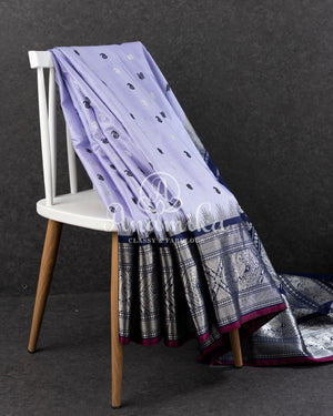 Lavender Gadwal Pattu saree with a contrast dark blue border and pallu
