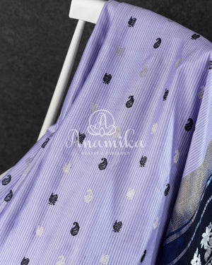 Lavender Gadwal Pattu saree with a contrast dark blue border and pallu
