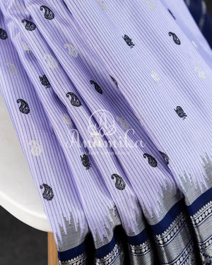 Lavender Gadwal Pattu saree with a contrast dark blue border and pallu