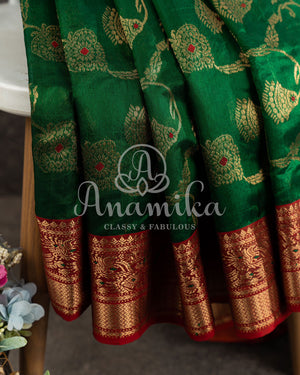 Dark Green Chanderi Silk saree with all over jaal weaving and a contrast red border