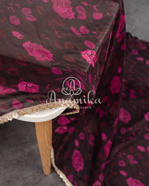 A georgette saree in black with beautiful floral prints