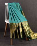 A grand Gadwal Kanchi saree in a beautiful blue and green combination