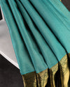 A grand Gadwal Kanchi saree in a beautiful blue and green combination
