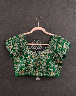 Heavy embroidered Bridal Blouse in Green with intricately designed cutwork neck and sleeves pattern