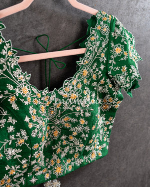 Heavy embroidered Bridal Blouse in Green with intricately designed cutwork neck and sleeves pattern