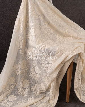 Off white Georgette Chikankari with a stylish off white self embroidered work blouse