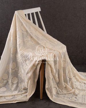 Off white Georgette Chikankari with a stylish off white self embroidered work blouse
