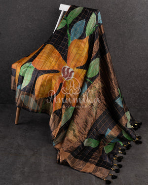 Tussar Saree in black with handpainting floral design, paired with orange ikkat rawsilk blouse