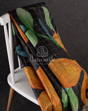 Tussar Saree in black with handpainting floral design, paired with orange ikkat rawsilk blouse