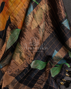 Tussar Saree in black with handpainting floral design, paired with orange ikkat rawsilk blouse