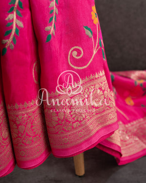 Pink Munga silk saree with all over floral vines and a contrast green handwork blouse