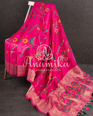 Pink Munga silk saree with all over floral vines and a contrast green handwork blouse