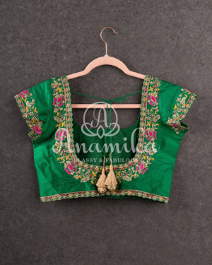 Pink Munga silk saree with all over floral vines and a contrast green handwork blouse