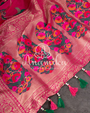Pink Munga silk saree with all over floral vines and a contrast green handwork blouse
