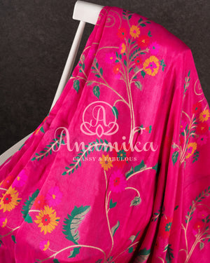 Pink Munga silk saree with all over floral vines and a contrast green handwork blouse