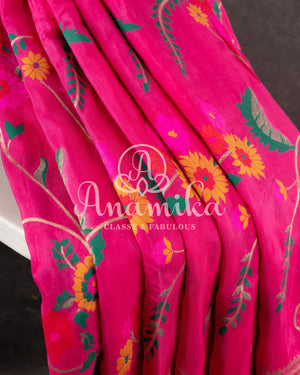 Pink Munga silk saree with all over floral vines and a contrast green handwork blouse