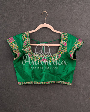 Pink Munga silk saree with all over floral vines and a contrast green handwork blouse