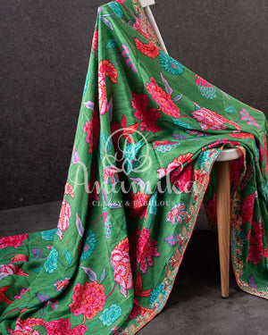 Floral Crepe Saree in Green with a handwork border and a contrast red blouse
