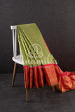 Gadwal pattu saree in a beautiful shade of parrot green and rose pink peach