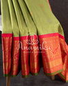 Gadwal pattu saree in a beautiful shade of parrot green and rose pink peach