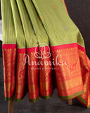 Gadwal pattu saree in a beautiful shade of parrot green and rose pink peach