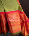 Gadwal pattu saree in a beautiful shade of parrot green and rose pink peach