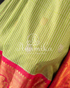 Gadwal pattu saree in a beautiful shade of parrot green and rose pink peach