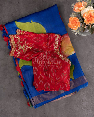 Tussar Saree in dark blue with handpainting floral design, paired with red ikkat rawsilk blouse