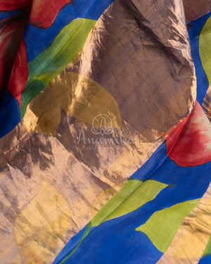 Tussar Saree in dark blue with handpainting floral design, paired with red ikkat rawsilk blouse