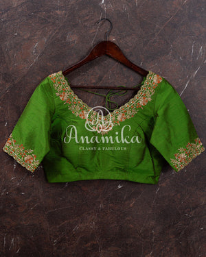 Kanjeevaram saree in a unique shade of light orangish yellow with green blouse