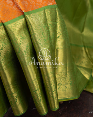 Kanjeevaram saree in a unique shade of light orangish yellow with green blouse