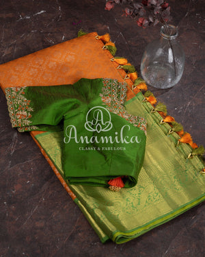Kanjeevaram saree in a unique shade of light orangish yellow with green blouse