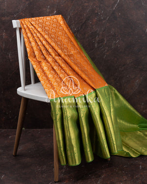 Kanjeevaram saree in a unique shade of light orangish yellow with green blouse