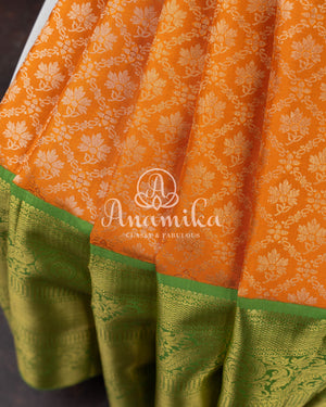 Kanjeevaram saree in a unique shade of light orangish yellow with green blouse
