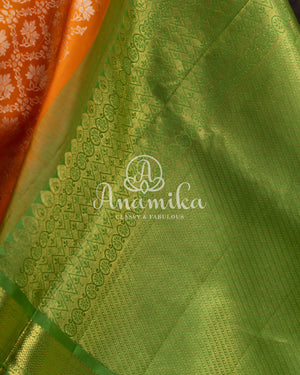 Kanjeevaram saree in a unique shade of light orangish yellow with green blouse