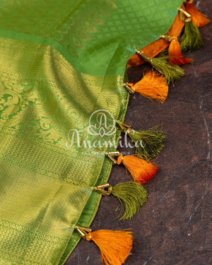 Kanjeevaram saree in a unique shade of light orangish yellow with green blouse