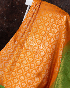 Kanjeevaram saree in a unique shade of light orangish yellow with green blouse