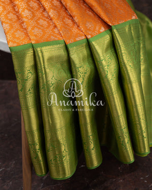 Kanjeevaram saree in a unique shade of light orangish yellow with green blouse